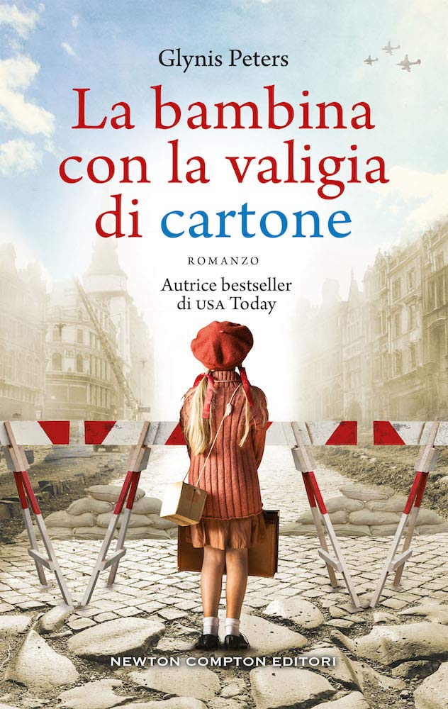 LA BAMBINA CON LA VALIGIA DI CARTONE